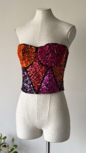archives theory chantal thomass runway fall winter 1992 pink orange red purple harlequin corset top sleeveless sequin and ribbon covered vintage bustier