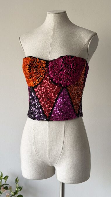 archives theory chantal thomass runway fall winter 1992 pink orange red purple harlequin corset top sleeveless sequin and ribbon covered vintage bustier