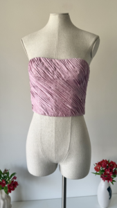 front view of vintage emanuel ungaro 1986 pink silk pleated corset with polka dot pattern and sweetheart neckline