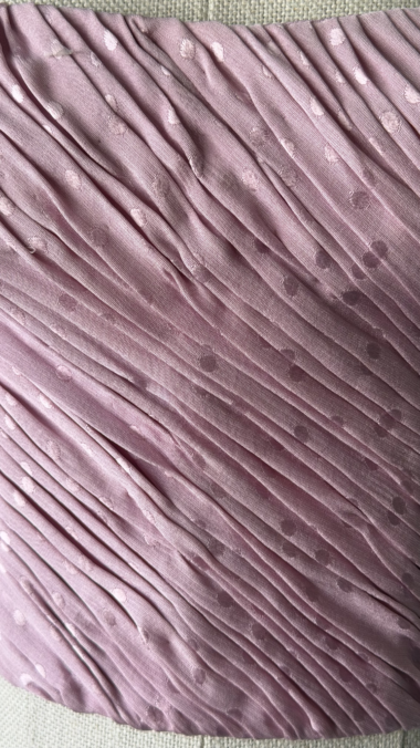 close-up of emanuel ungaro corset side zip closure on pink silk fabric