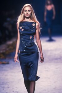 Fashion model on the runway of Chloé Fall Winter 1998 by Stella McCartney ready-to-wear collection, photographed by Guy Marineau, wearing a blue silk dress with floral embroideries